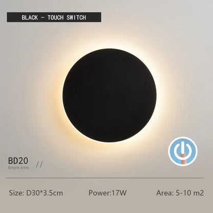 Black round wall light with text and specifications on a gray background