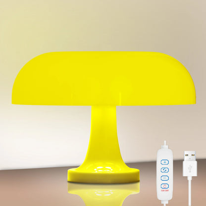 Yellow table lamp with remote control and power adapter on a beige background