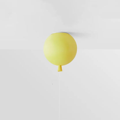 Yellow balloon-shaped lamp on a white background
