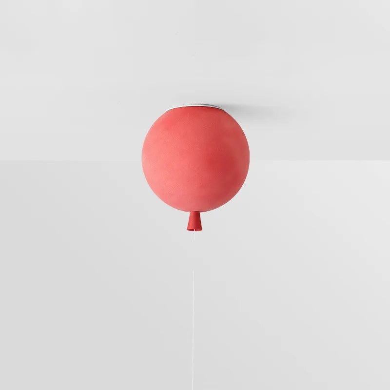 red balloon-inspired ceiling lamp providing soft LED light for play areas.