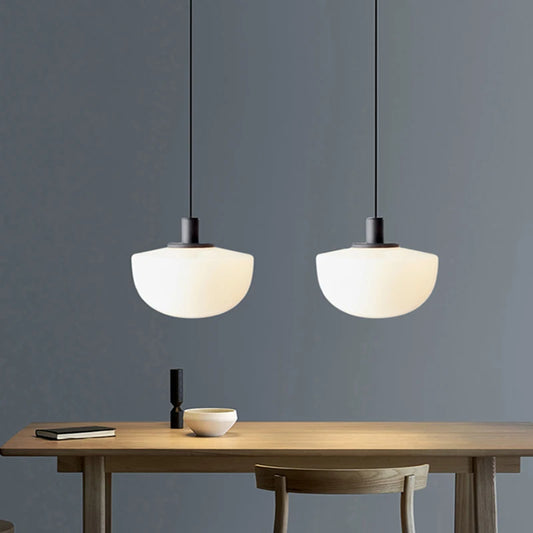 Modern Pendant Lights in white glossy glass for a minimalist Nordic kitchen.