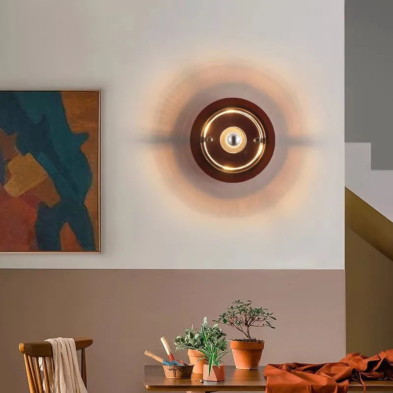 UFO bedside wall sconce installed above a minimalist nightstand.