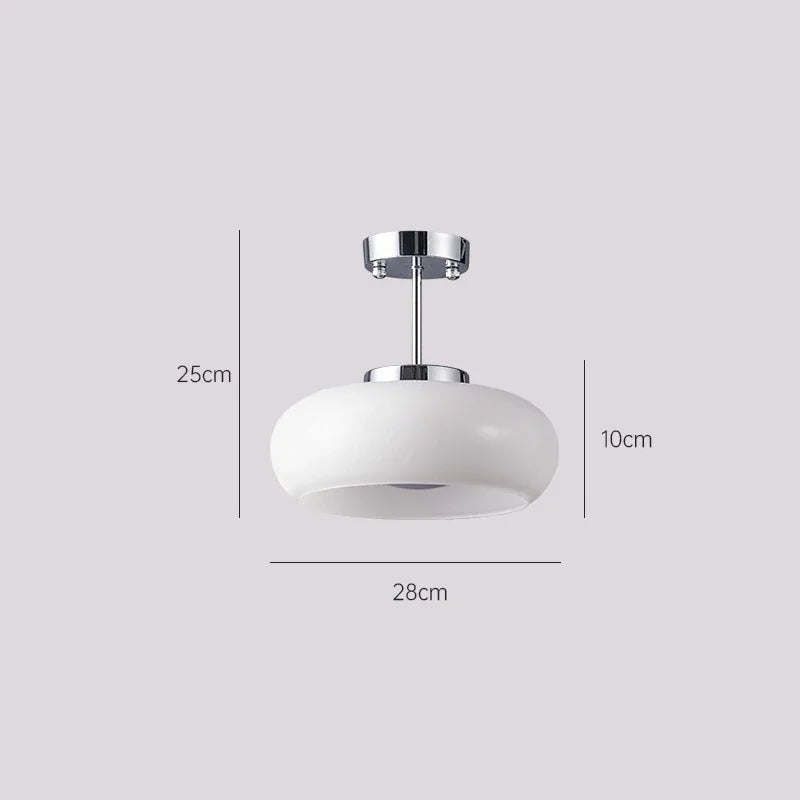 White ceiling light fixture with dimensions on a gray background